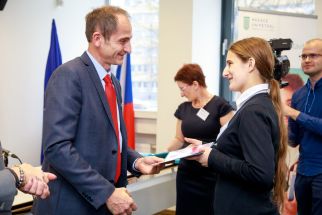 Kamila Starkbaumová, a student of Masaryk's High School of Chemistry in Usti nad Labem, awarded by prof. Pavel Kotrba of the UCT Prague